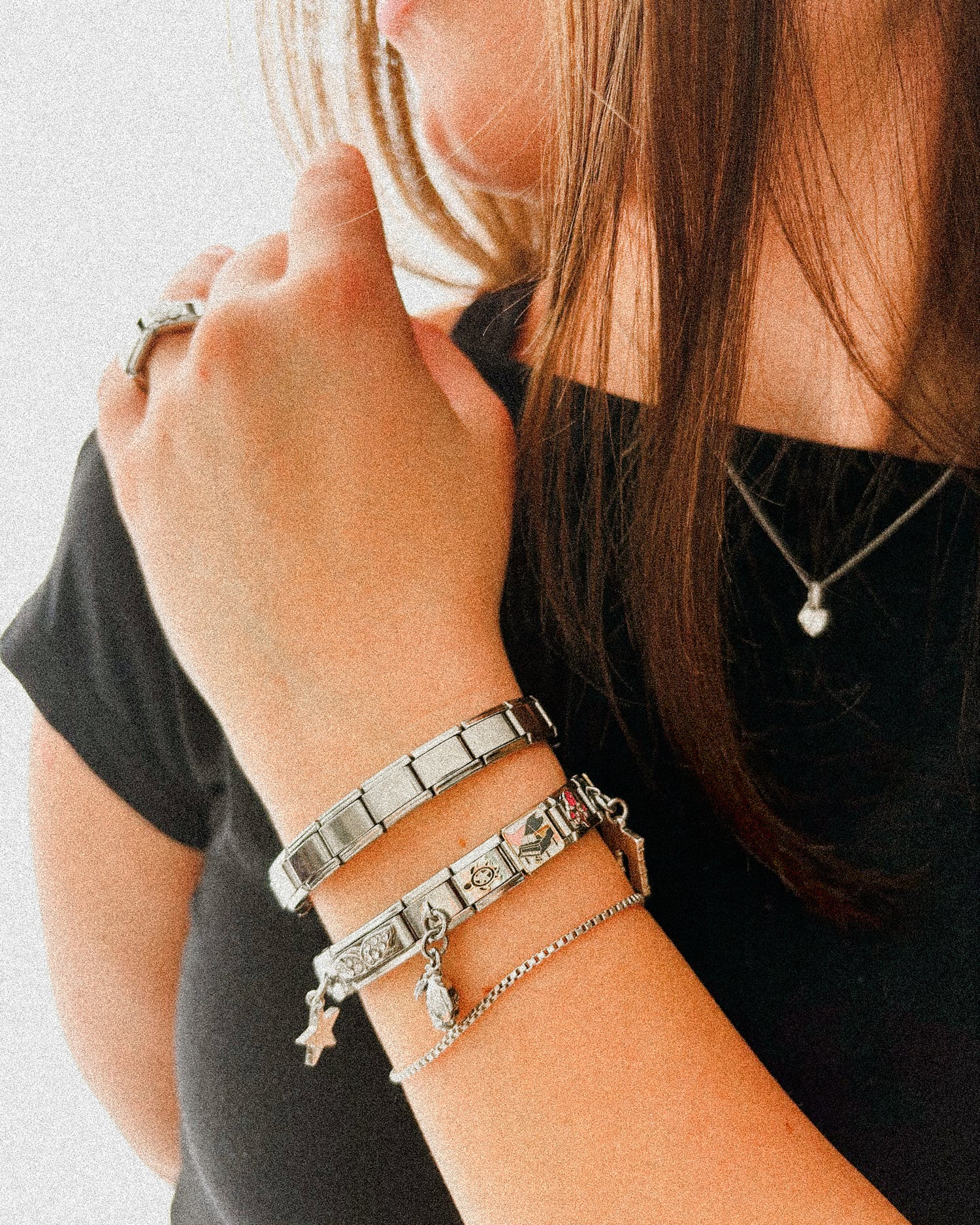 Close up of 9mm Italian charm bracelet with stainless steel links and personalized enamel charms