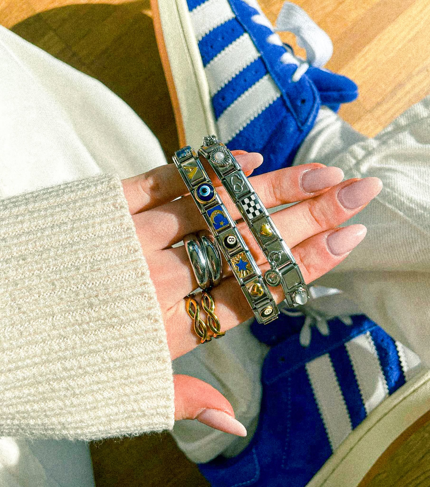 Woman wearing custom Italian charm bracelet, 9mm charm bracelet styled for modern everyday fashion